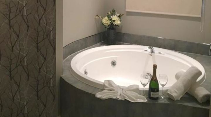 two single beds in a bedroom of 2-bedroom unit