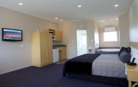 large studio with a super-king bed and a single bed